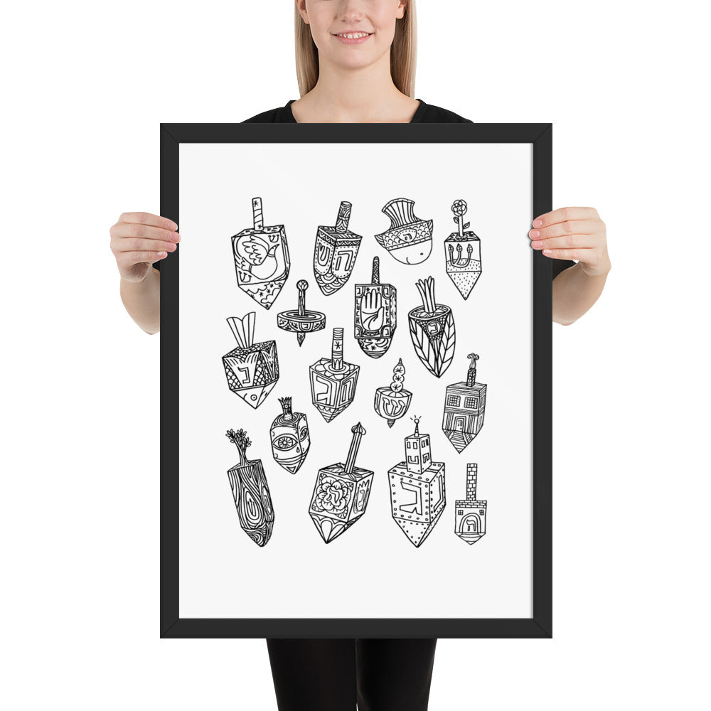 A woman holding the dreidel poster to show the scale of the frame against a standing adult 