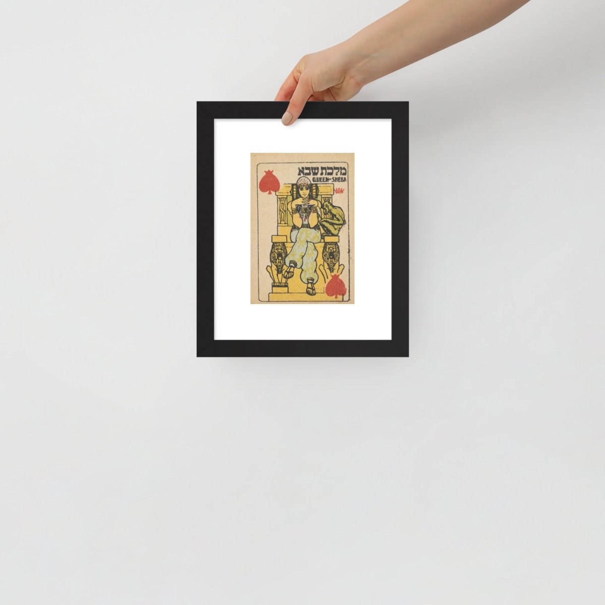 Hand holding Bath Sheba framed Artwork for scale