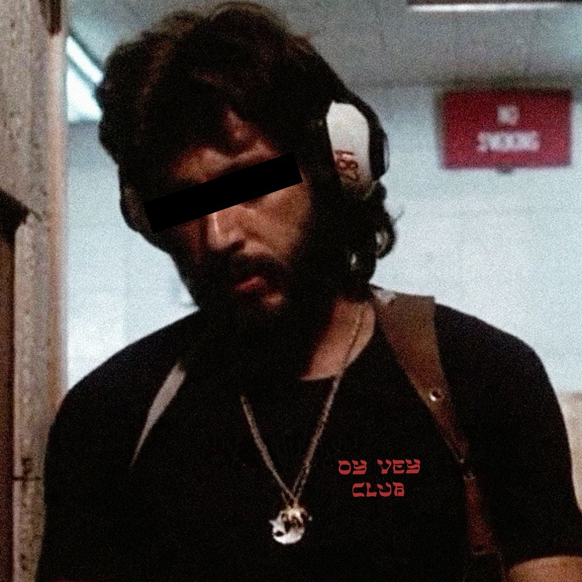Man wearing Oy Vey Club T-shirt in black 