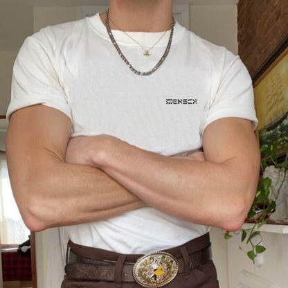 Man wearing white Mensch T-shirt