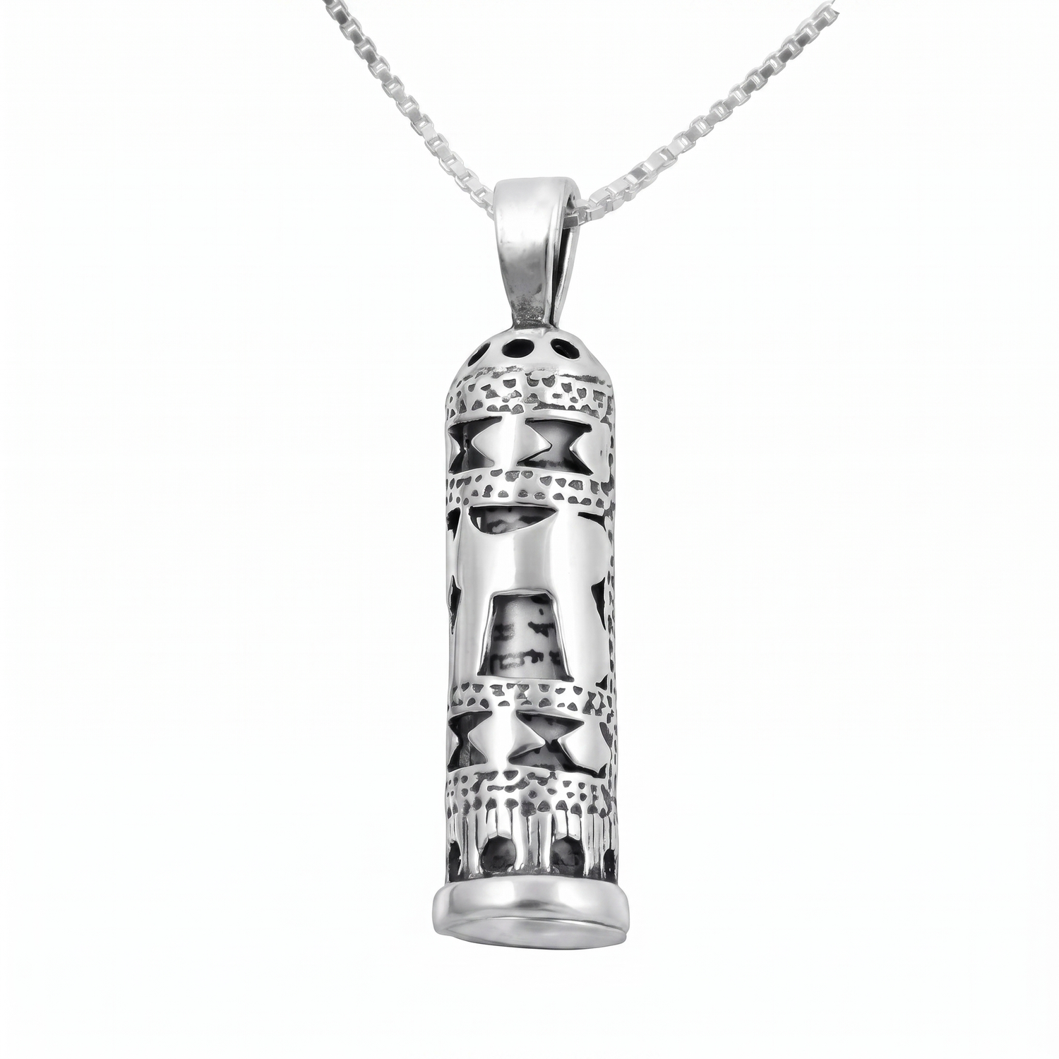A silver cylindrical mezuzah pendant necklace with intricate cutout patterns and a bail, suspended from a silver box chain against a plain white background.
