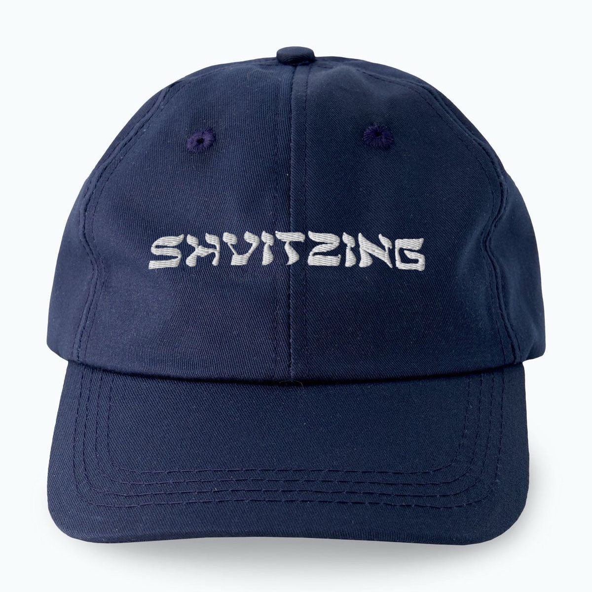 Navy blue cap with 'SHVITZING' text on a white background