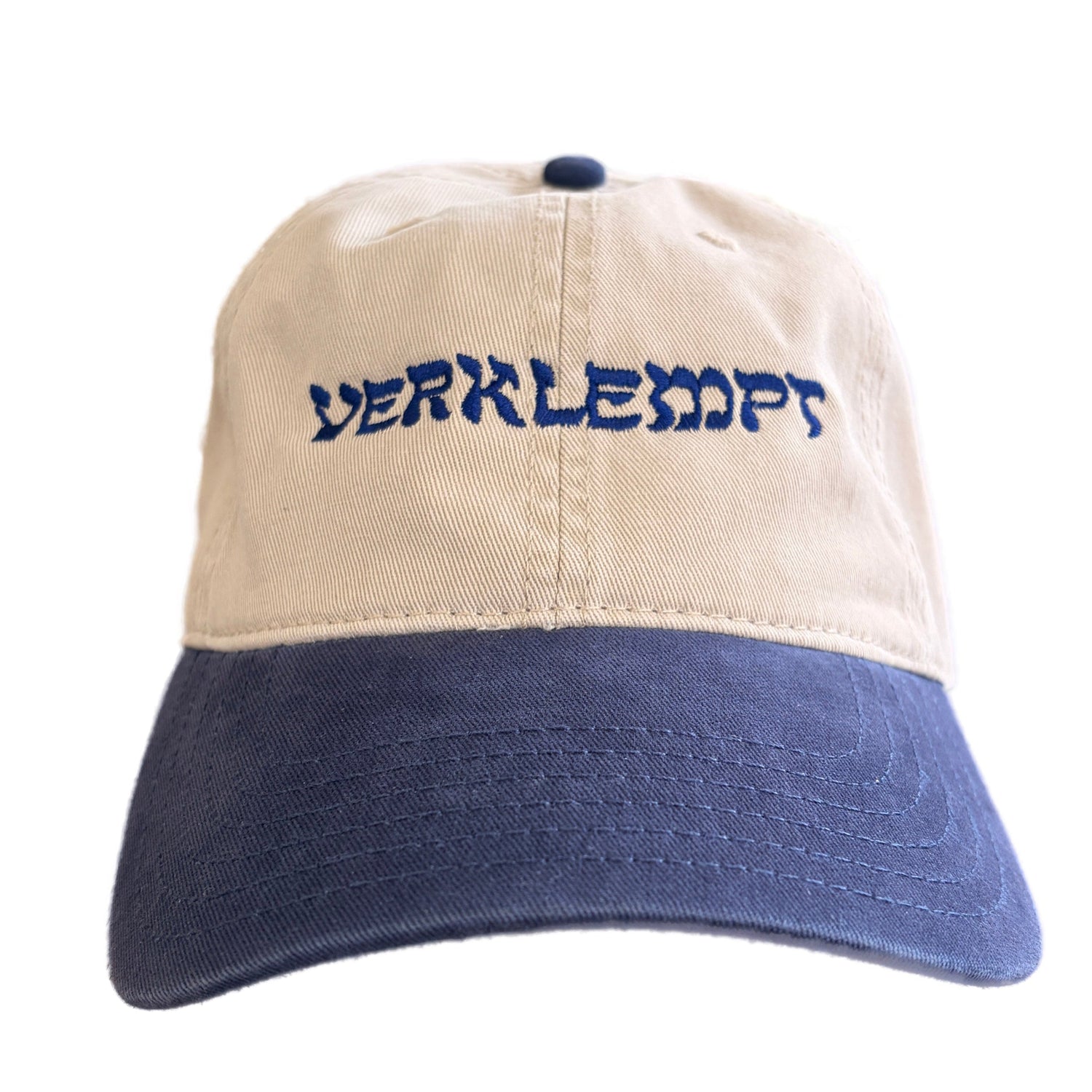 A two-tone baseball cap with a beige crown and a navy blue brim, featuring the word 'VERKLEMPT' embroidered in navy blue across the front.