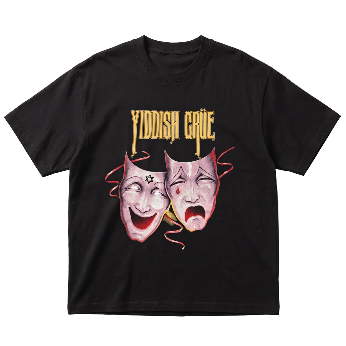 A black short-sleeve t-shirt with a graphic print featuring the words 'YIDDISH CRUE' in gold above two theatrical comedy and tragedy masks in pink, red, and white, laid flat on a light gray background.