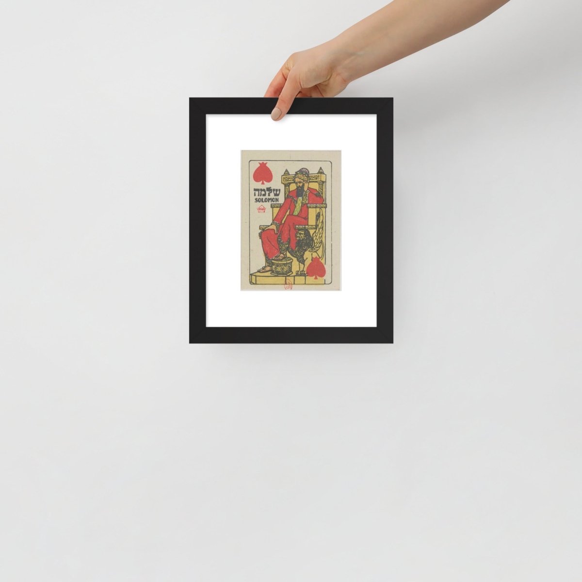and holding King Solomon artwork framed for scale 