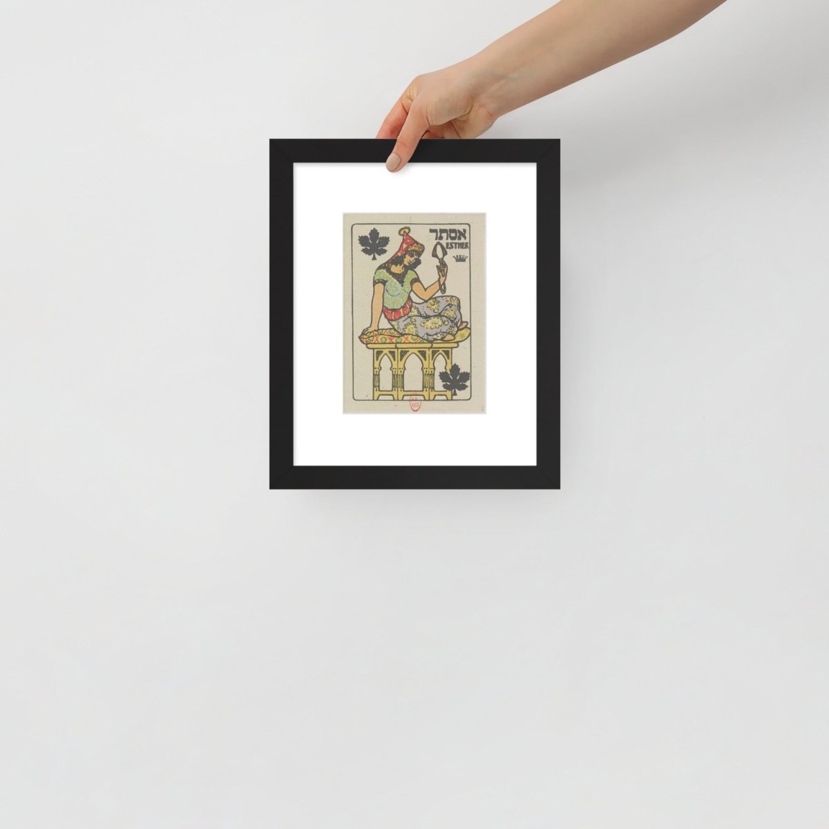 hand holding the Esther poster framed for scale purposes 