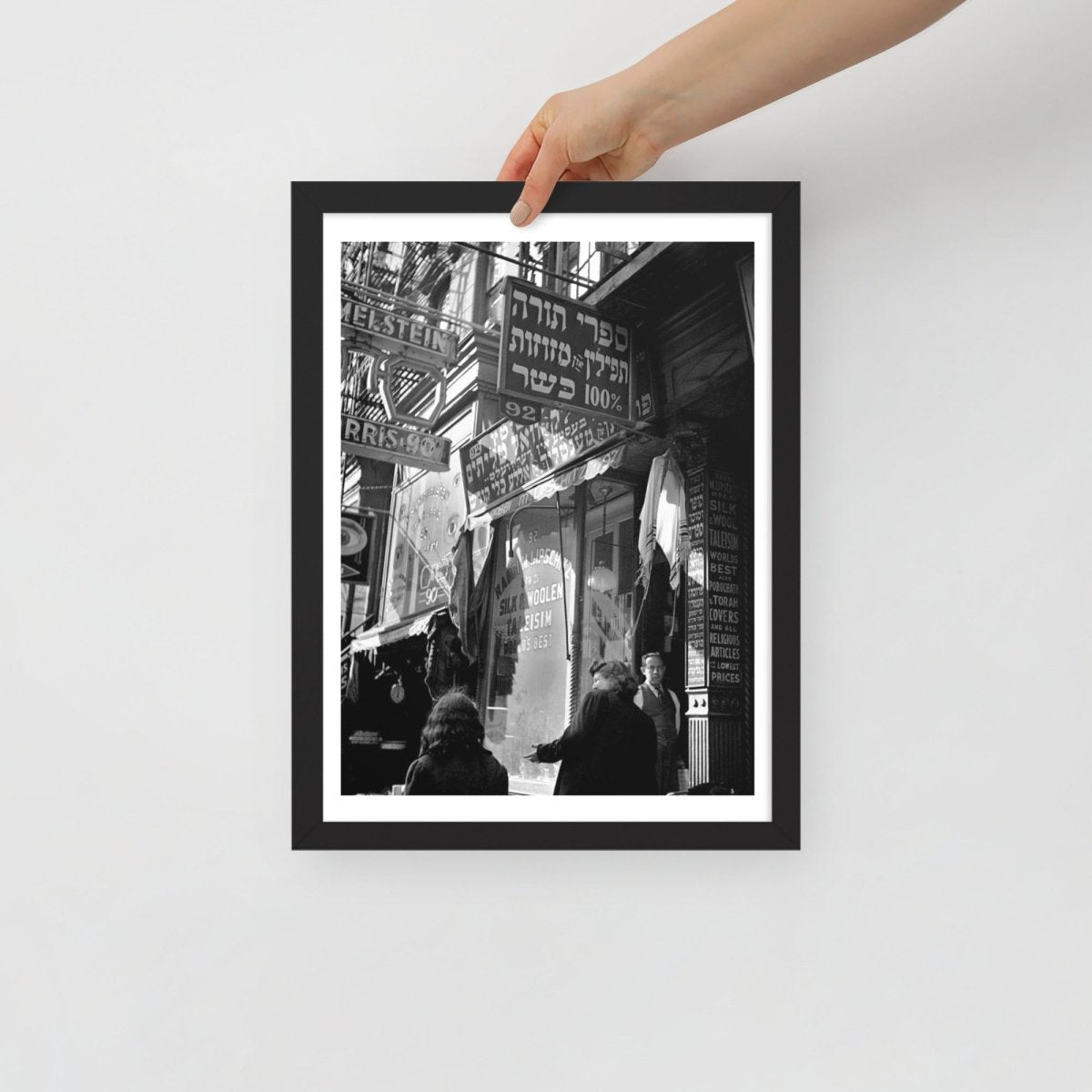 hand holding the New York Yiddish 12x16 poster framed for scale