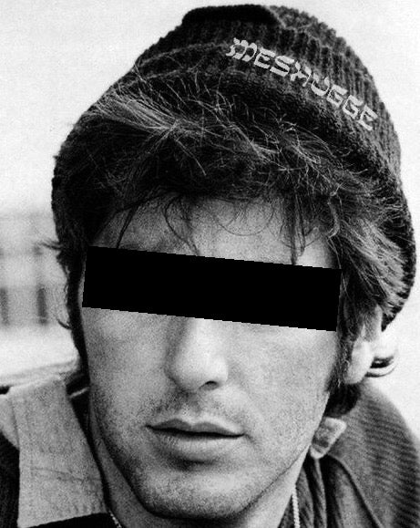 Man wearing the Meshugge beanie in black 