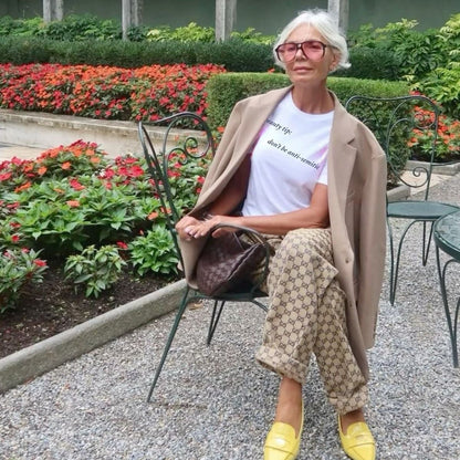 older woman wearing a "Beauty Tip" Don't be anti-Semitic" T-shirt