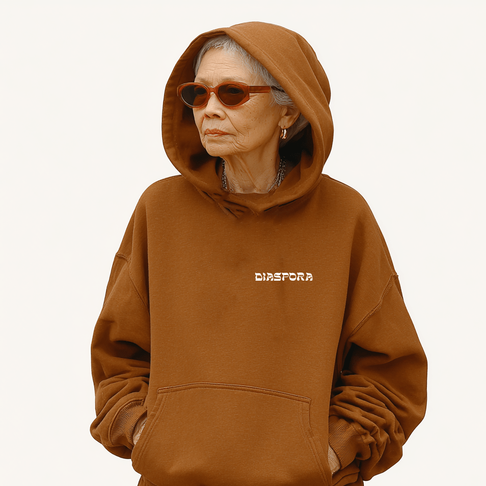 Woman wearing Meshugge's Jespora hoodie in brown